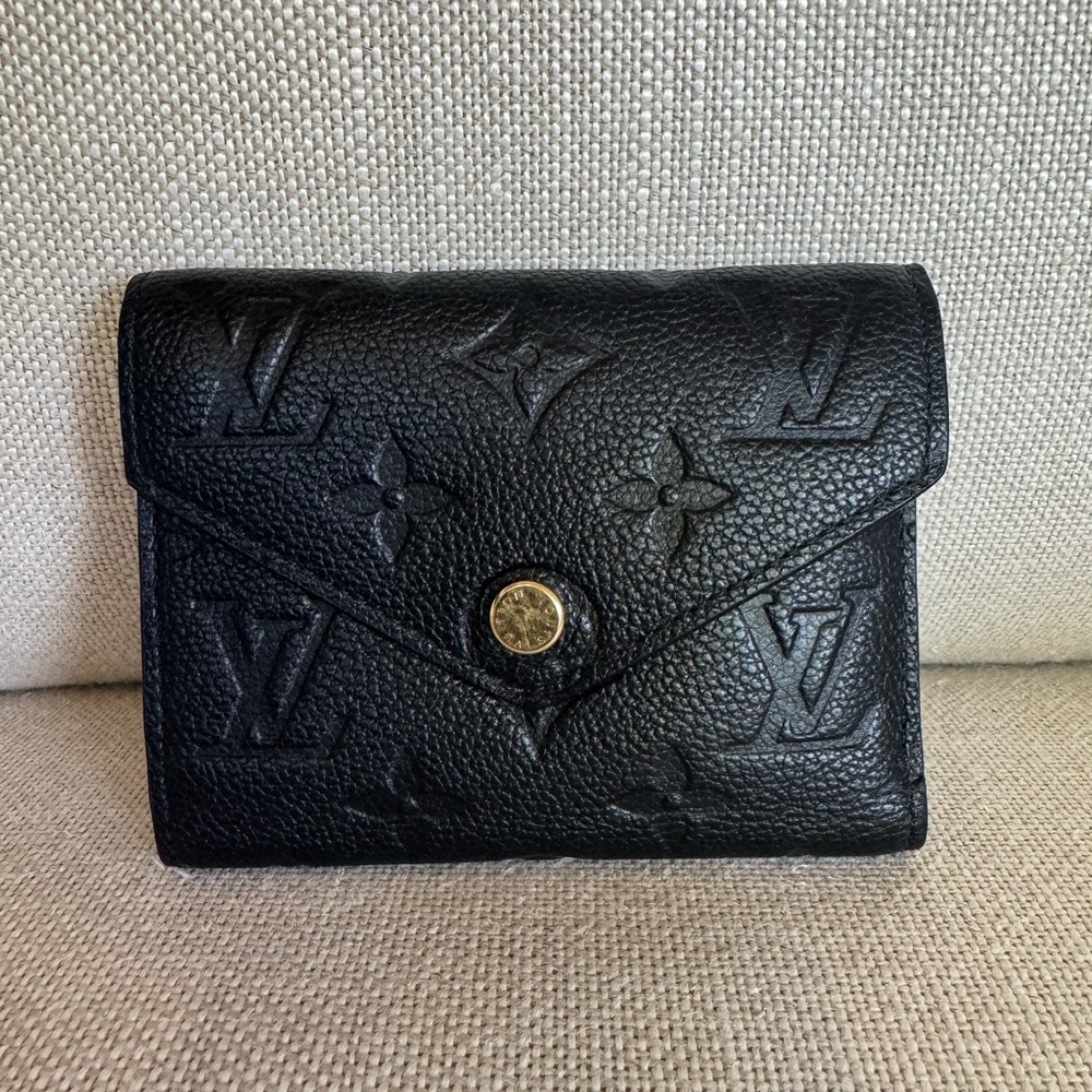 Louis Vuitton Victorine Monogram Empreinte Black Leather Wallet.